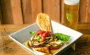 Elevated bistro-style dish paired with craft beer at Artisanal Brew Works restaurant in Saratoga Springs, NY.