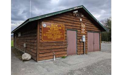 shed type building with a sign saying welcome lake george village rec center