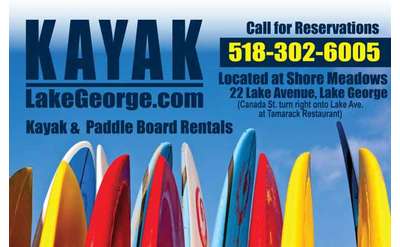 row of colorful paddleboards with text that says kayaklakegeorge.com and call for reservations 518-302-6005