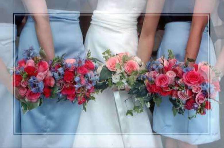 bride and bridesmaids holding colorful bouquets