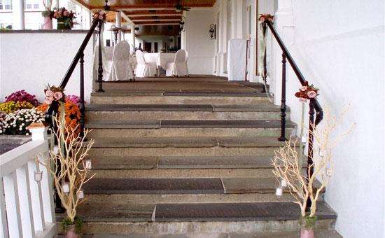 a small flight of wooden stairs decorated with flowers