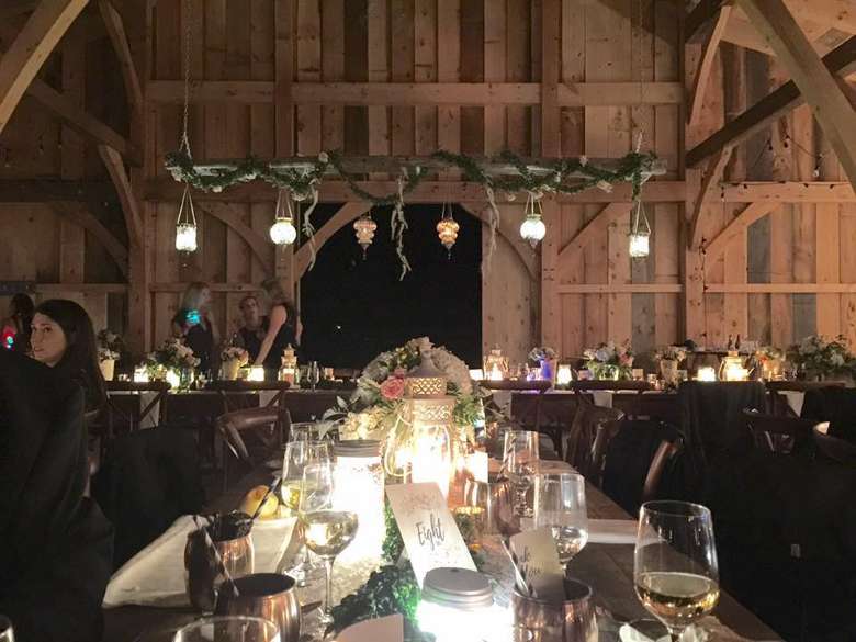 long table inside a wedding reception venue at night