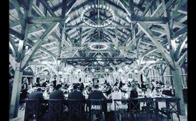 black and white photo of the head table at a wedding reception