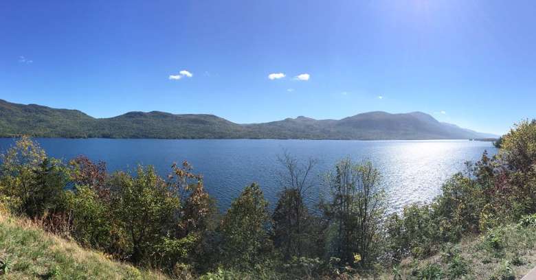 panoramic shot of a lake on a sunny day