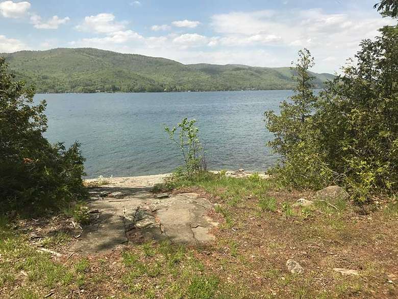 A rocky ledge overlooking Lake George at Campsite #1