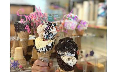 hands holding two ice cream cones