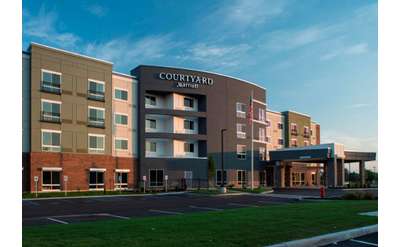 the front entrance of the Courtyard Clifton Park by Marriott