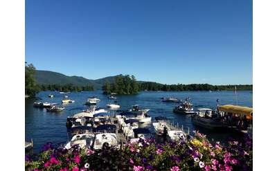 boats at a marina with a view of the lake in the background