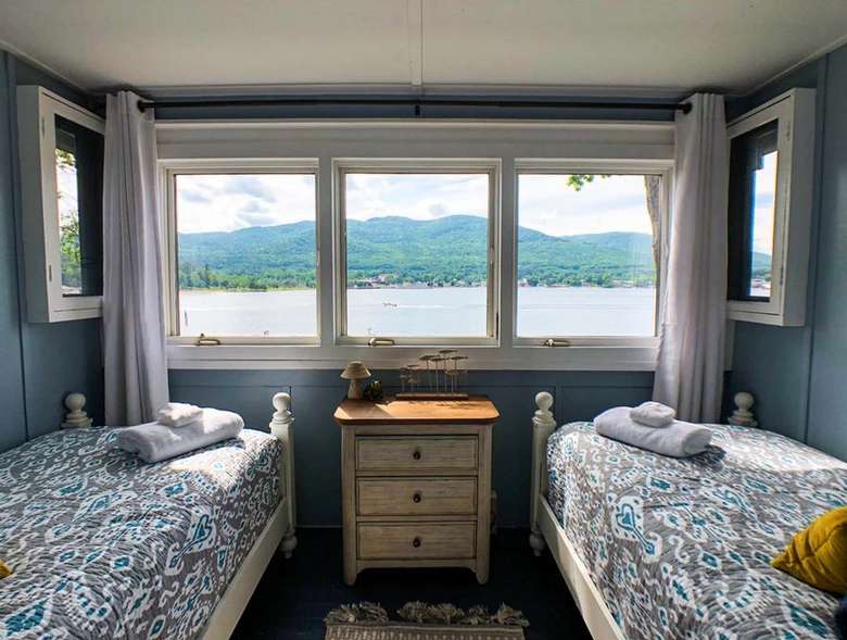 two beds and windows with lake views