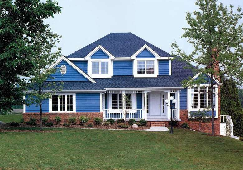 a bright blue house with a dark blue roof and white around the edges