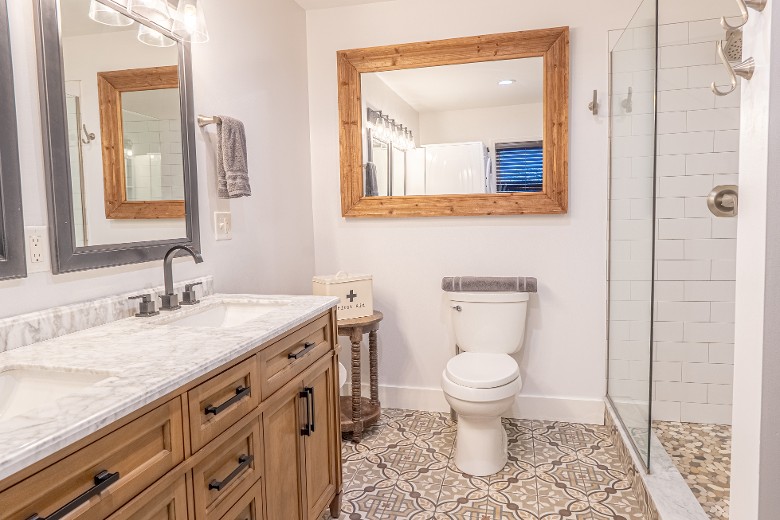 Main Floor Bathroom with double sink and shower. Washer and dryer are in this area as well. Main Floor Bathroom