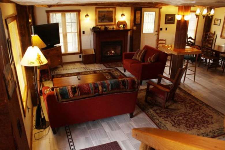 the living room with Adirondack-style furniture