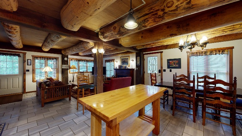 view of open plan downstairs with both living room and dining area visible
