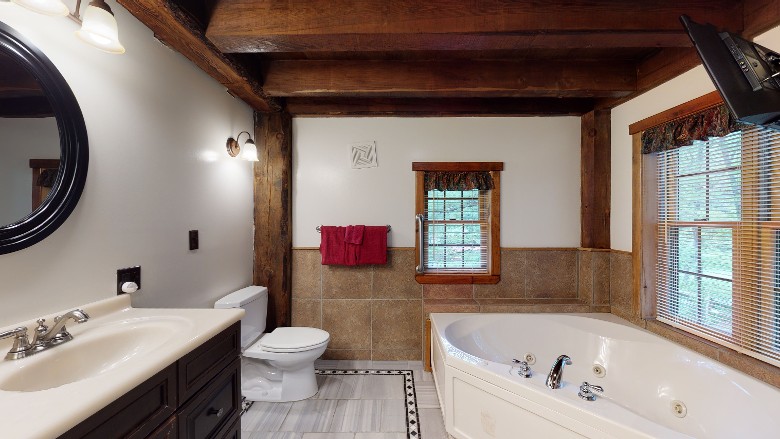 bathroom with large jet tub