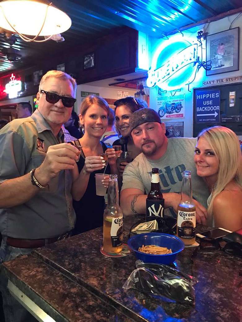 group of people at bar posing