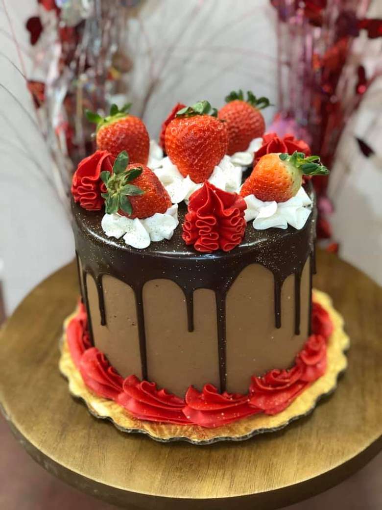 a chocolate cake with strawberries on top