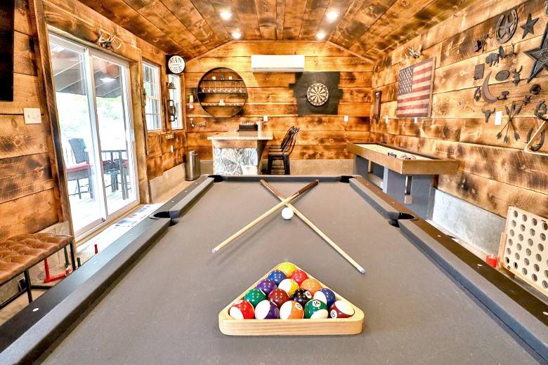 The bar/game room has a pool table and dartboard.  Perfect for small gatherings.