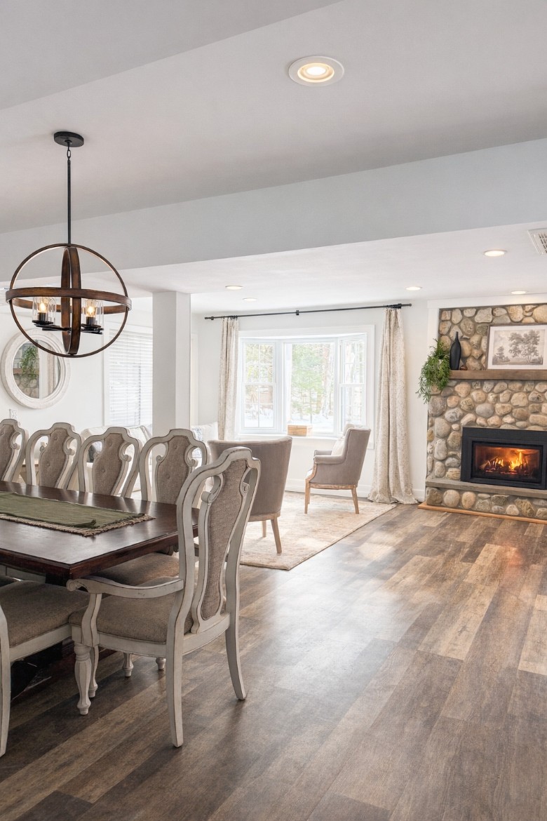 Main level dining and living room area with a gas fireplace