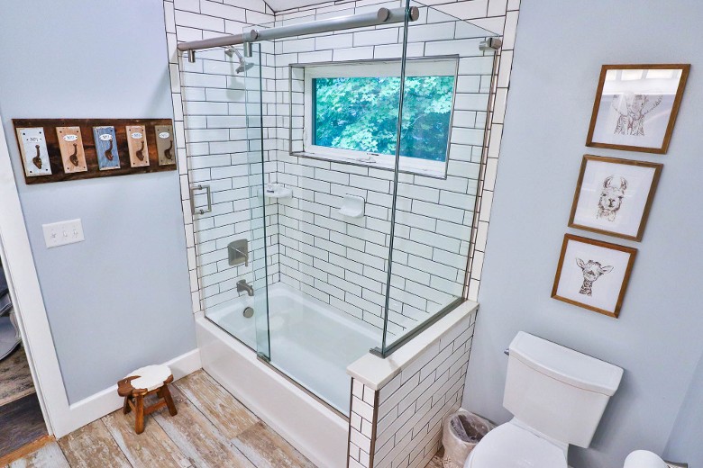 Upstairs bathroom with a tub/shower combo, near the bunk bed room
