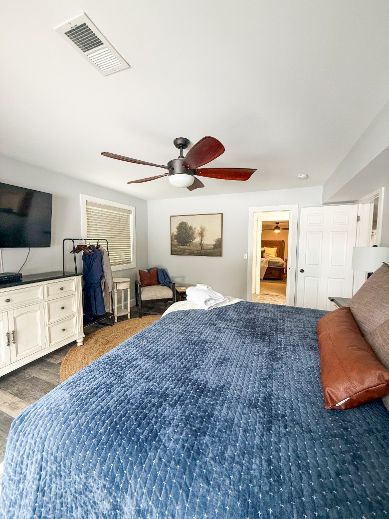 Main level king bedroom, bathroom with a shower is located between the king bedroom and the queen bedroom. Patio doors in the king bedroom lead out to the deck.