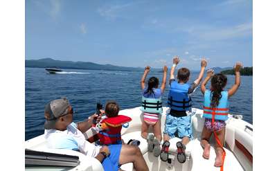 four kids on a boat on Lake George