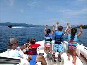 four kids on a boat on Lake George