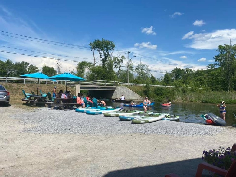 kayaks and paddleboards at the shore