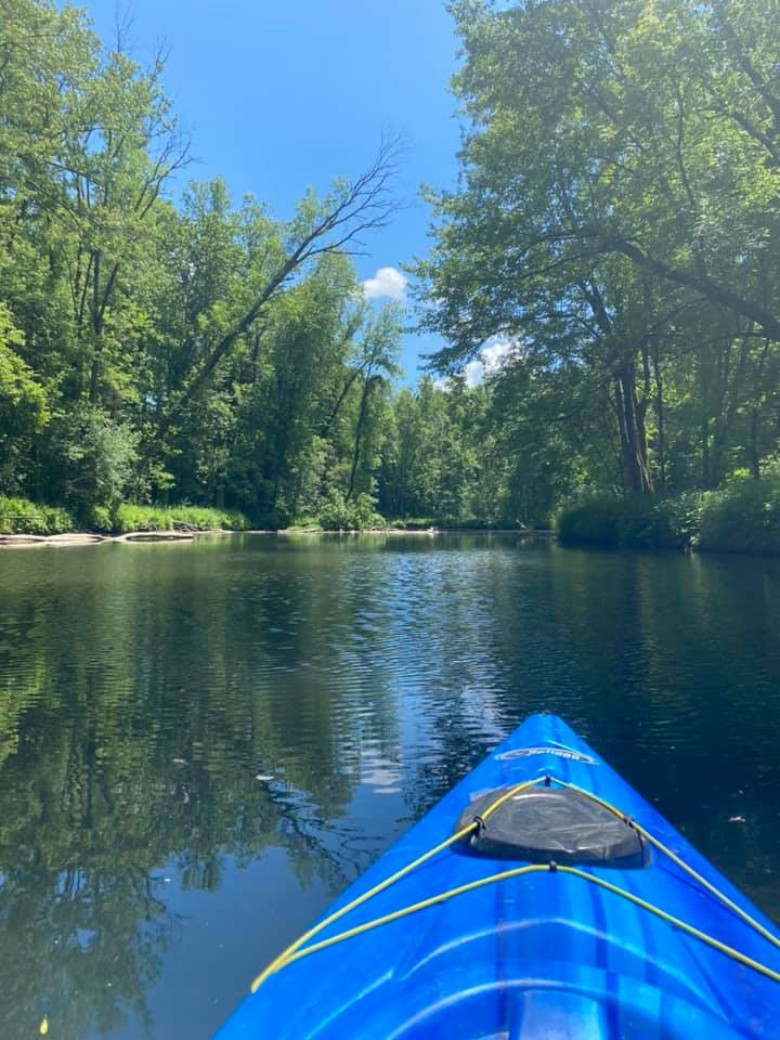 blue kayak in stream