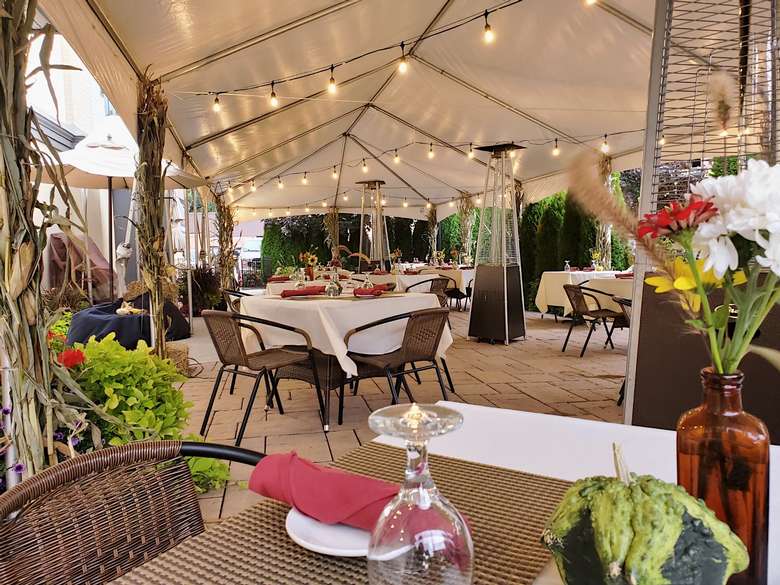 tables under a patio tent