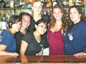 group photo of smiling staff members at SJ Garcia's