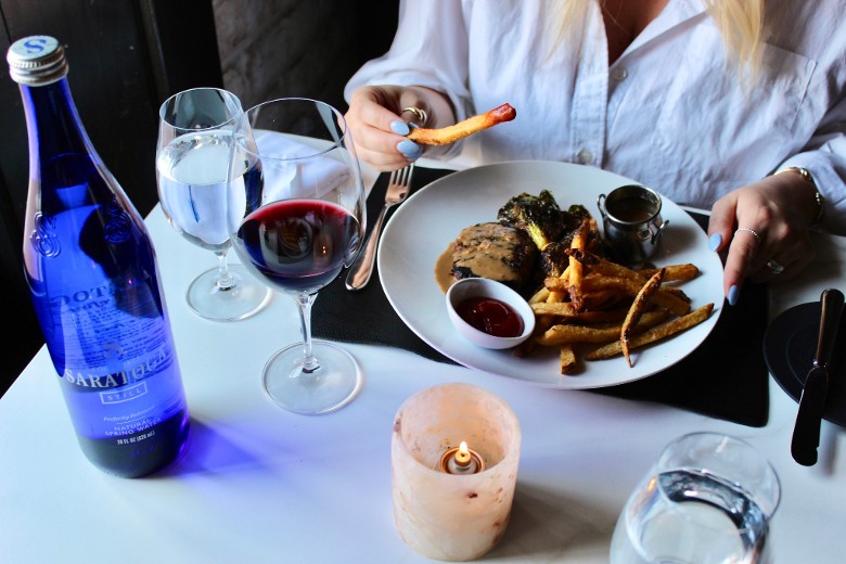 woman with steak and fries