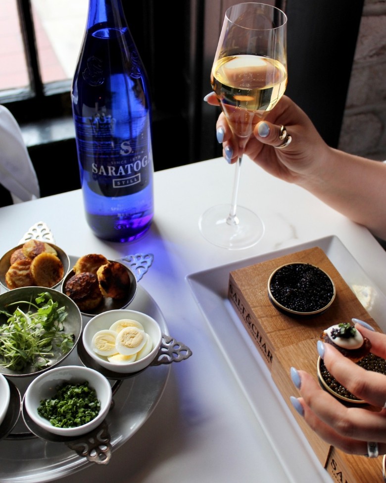 woman with wine and caviar