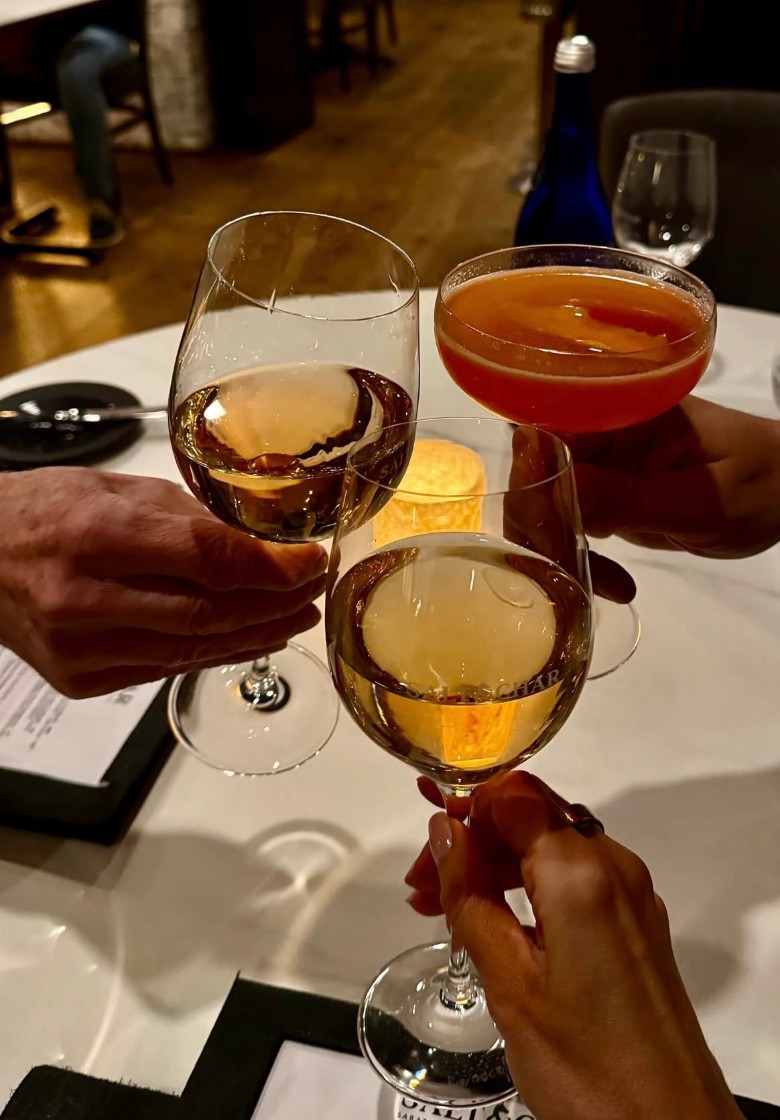 three people with drinks