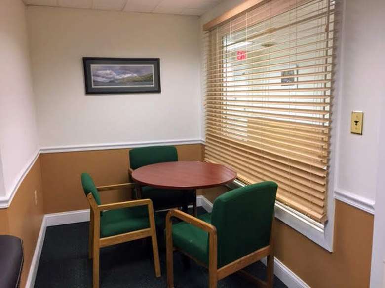 office room with chair and tables