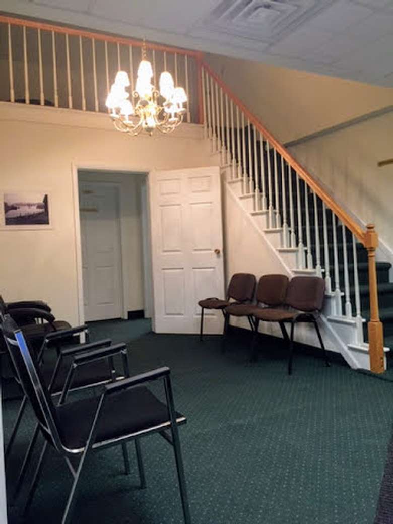 lobby area of office building, stairs, chandelier