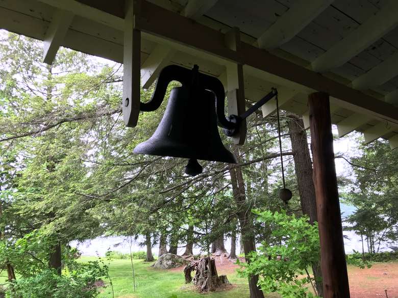 dinner bell hanging from the porch
