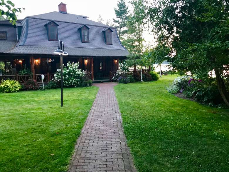 a stone pathway connects Dining Lodge and original lodge