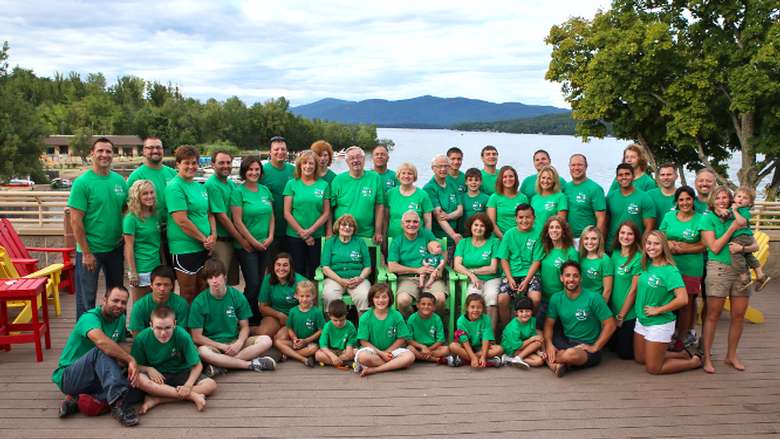 large group of people wearing green shirts