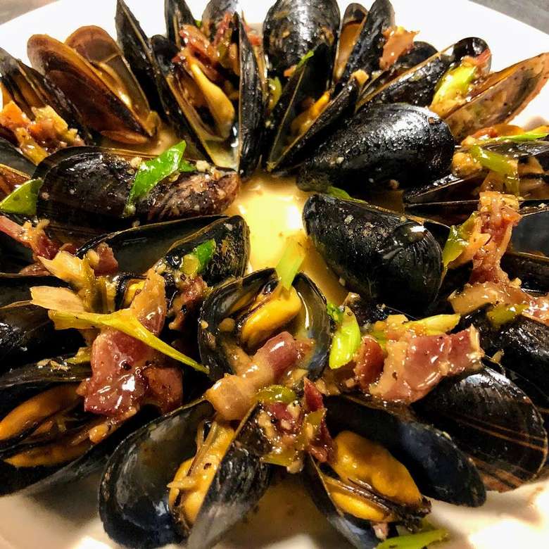 a seafood dish with muscles