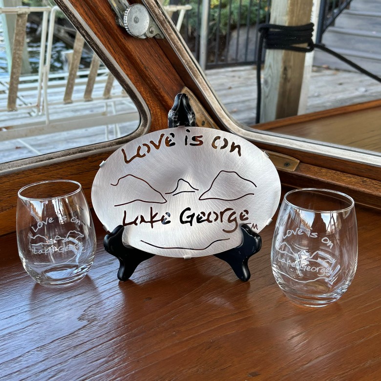 Lake George Stainless trivet with a pair of Love is on Lake George stemless wine glasses.