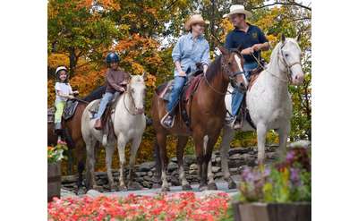 family of four on horses