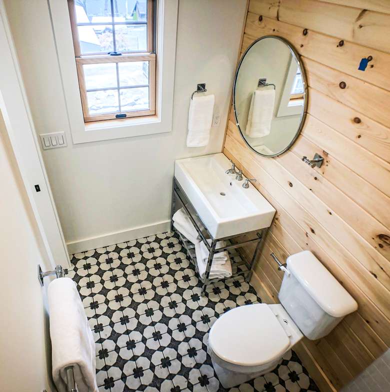 bathroom with wooden walls