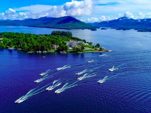 Aerial view of boats on Lake George with an island in view