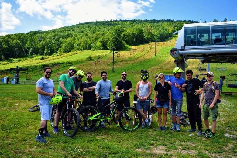 group of mountain bikers near a chairlift