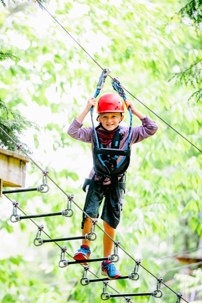 young boy on ropes course