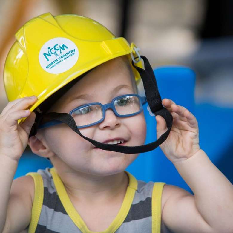 toddler in construction hat