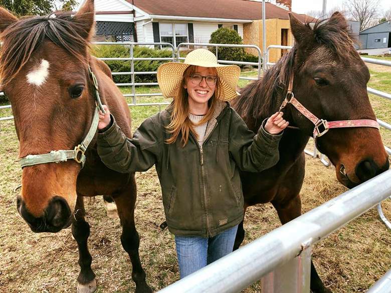 woman with two horses