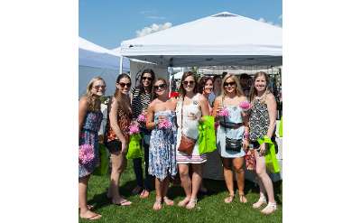 A group of friends attends the Adirondack Wine & Food Festival.