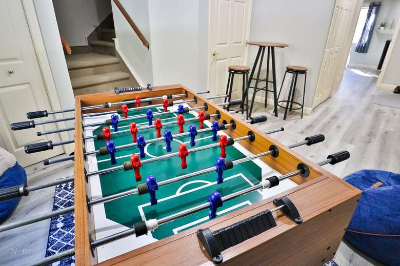 game room with a foosball table