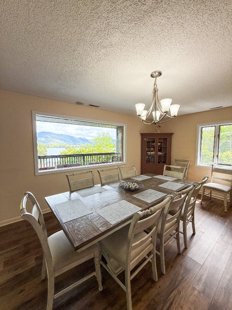 a dining room with a table and chairs Second level dining room